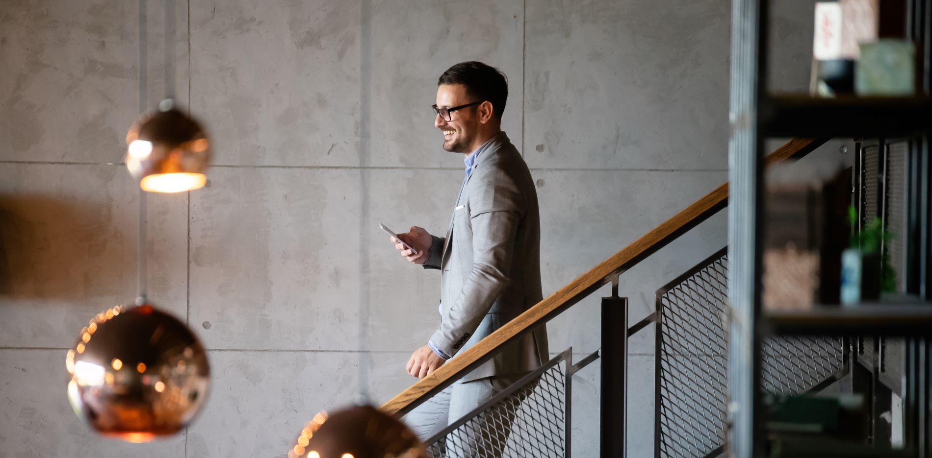 executive business man walking down a staircase